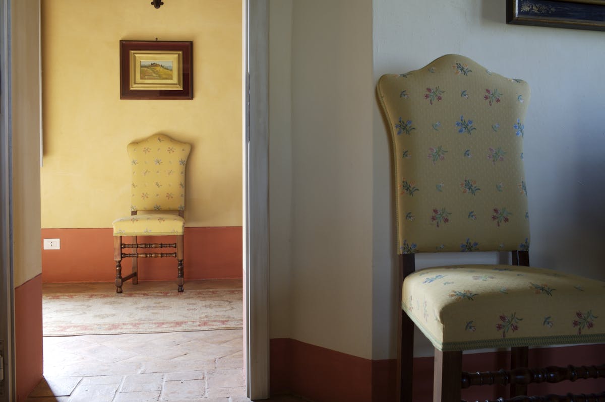 a bedroom with a bed and a mirror